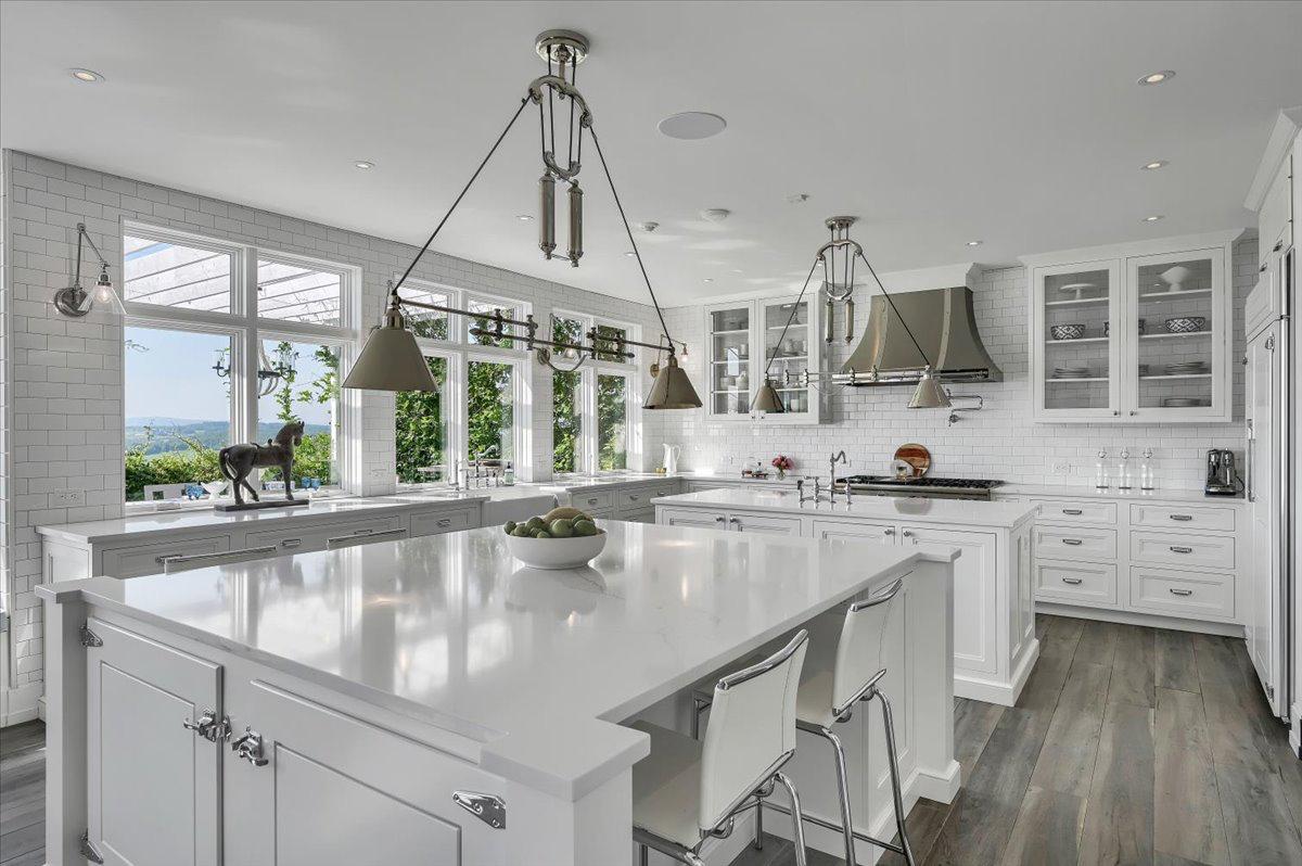 Professional chefs kitchen at The Maple Overlook — large marble island, subway tile, valley views, upstate New York vacation rental