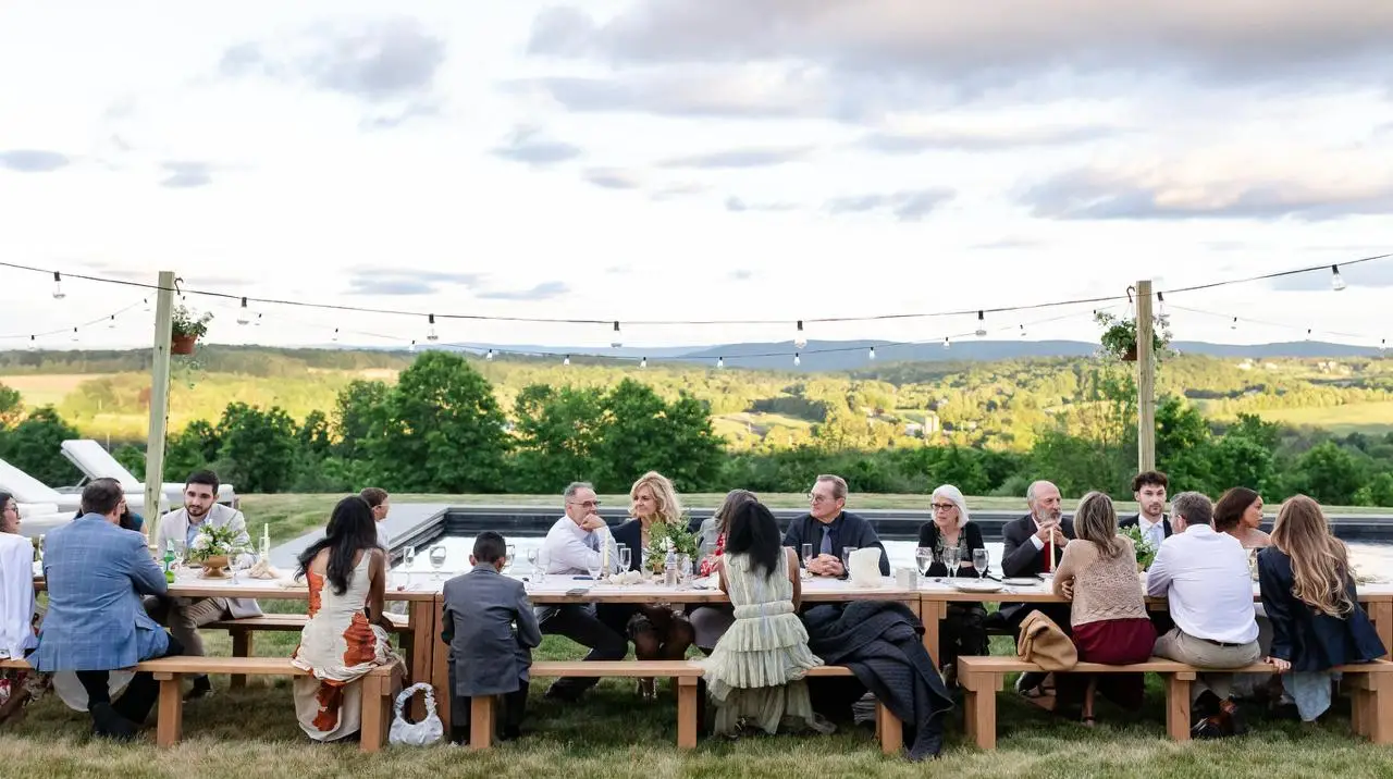 Wedding reception guests celebrating poolside at The Maple Overlook — intimate wedding in the Hudson Valley
